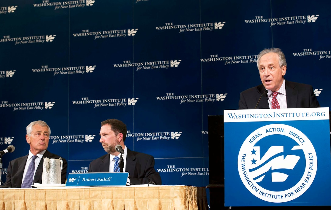 Martin J. Gross, president of the Washington Institute for Near East Policy, introduces Defense Secretary Chuck Hagel, left, at the institute's 2013 Soref Symposium in Washington, D.C., May 9, 2013. 