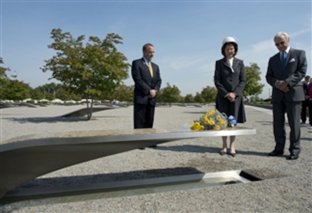 Carl XVI Gustaf, right, King of Sweden and his wife Queen Silvia pause for a moment of silence after placing a bouquet of flowers on a bench at the Pentagon Memorial on May 10, 2013.  Queen Silvia laid the flowers on the bench of Dana Falkenberg, the youngest person to be killed at the site on Sept. 11, 2001.  President of the Pentagon Memorial Fund Jim Laychak gave the king and queen a personal tour of the memorial.  