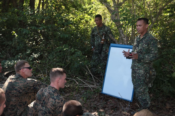 130410-M-UU132-688 ZAMBALES, Philippines— (April 10, 2013) Philippine Marine Sgt. Bimbo Busico, a Jungle Environmental Survival Training instructor and intelligence analyst with the Philippines Force Reconnaissance Battalion, teaches a class about jungle environmental safety to U.S. service members from the Marine Corps’ 3rd Law Enforcement Battalion and Combat Logistics Regiment 35 during Exercise Balikatan 2013. Balikatan is an annual Philippine-U.S. bilateral exercise. Humanitarian assistance and training activities enable the Philippine and American service members to build lasting relationships, train together and provide assistance in communities where the need is the greatest.  
