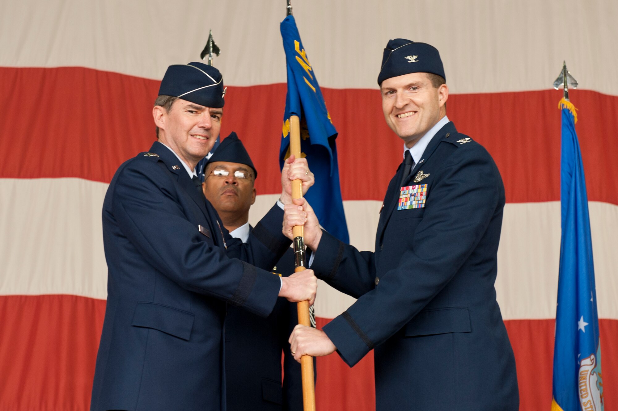 Lt. Gen. Jan-Marc Jouas, 7th Air Force commander, transfers command of the 8th Fighter Wing to Col. S. Clinton Hinote during the 8th FW change of command ceremony at Kunsan Air Base, Republic of Korea, May 10, 2013. Hinote is the 53rd commander to be called “Wolf.” (U.S. Air Force photo by Staff Sgt. Jonathan Fowler/Released)
