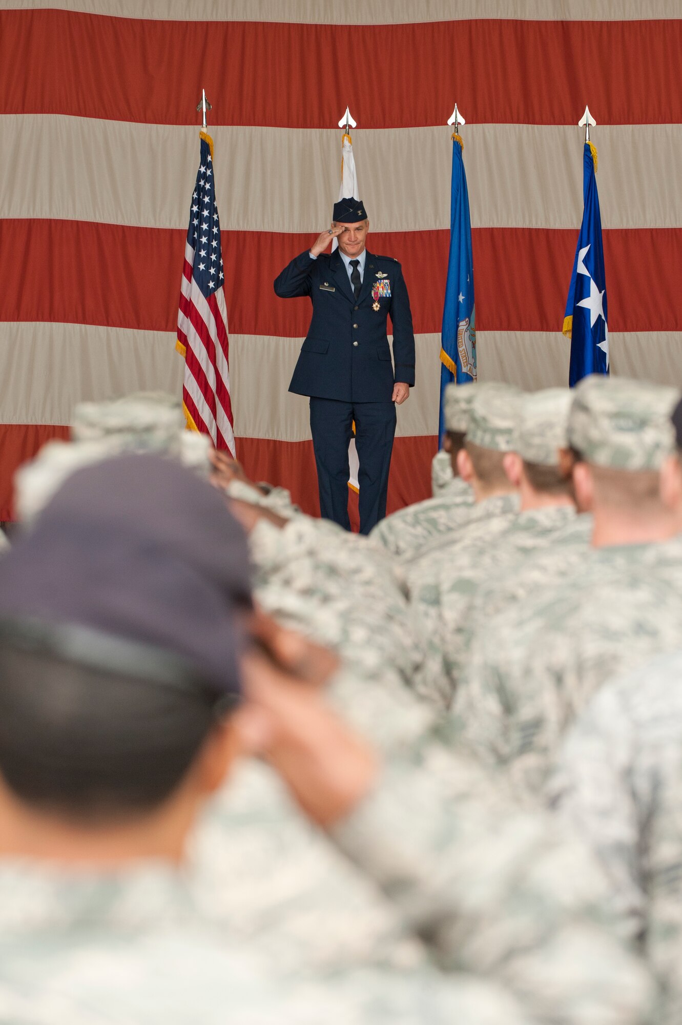 KUNSAN AIR BASE, Republic of Korea -- Col. John W. Pearse, outgoing 8th Fighter Wing commander, receives his final salute as commander of the Wolf Pack during the 8th FW change of command ceremony at Kunsan Air Base, Republic of Korea, May 10, 2013. Pearse led the wing to an “excellent” rating on its combined operational readiness and compliance inspection. (U.S. Air Force photo by Staff Sgt. Jonathan Fowler/released)