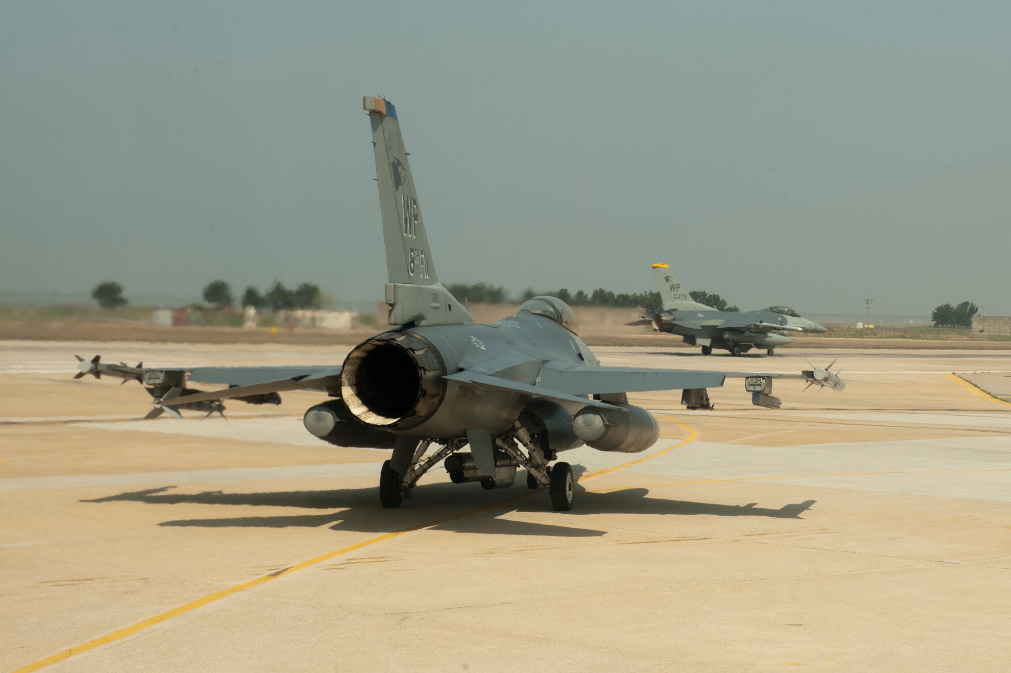 Col. John Pearse, 8th Fighter Wing commander, waits for his turn to take off during a friendship flight with  Col. Min Oh Seo , Republic of Korea 38th Fighter Group commander, at Kunsan Air Base, Republic of Korea, May 1, 2013. The pilots took turns being friendly forces simulating training scenarios. (U.S. Air Force photo by Senior Airman Marcus Morris/Released)