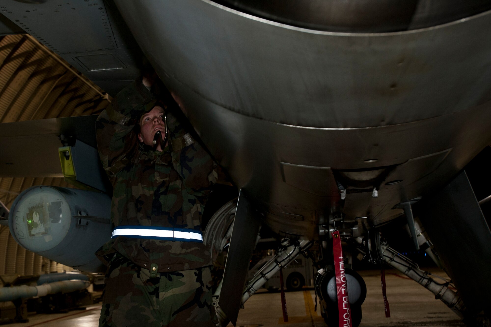 KUNSAN AIR BASE, Republic of Korea – Staff Sgt. Michelle Lesley, 35th Aircraft Maintenance Unit crew chief, tightens fasteners on an F-16 Fighting Falcon’s panel during exercise Beverly Bearcat 13-1, at Kunsan Air Base, Republic of Korea, April 10, 2013. A basic post flight inspection is performed after each flight to ensure the aircraft is combat ready for 8th Fighter Wing pilots. (U.S. Air Force photo by Staff Sgt. Tong Duong/ Released)
