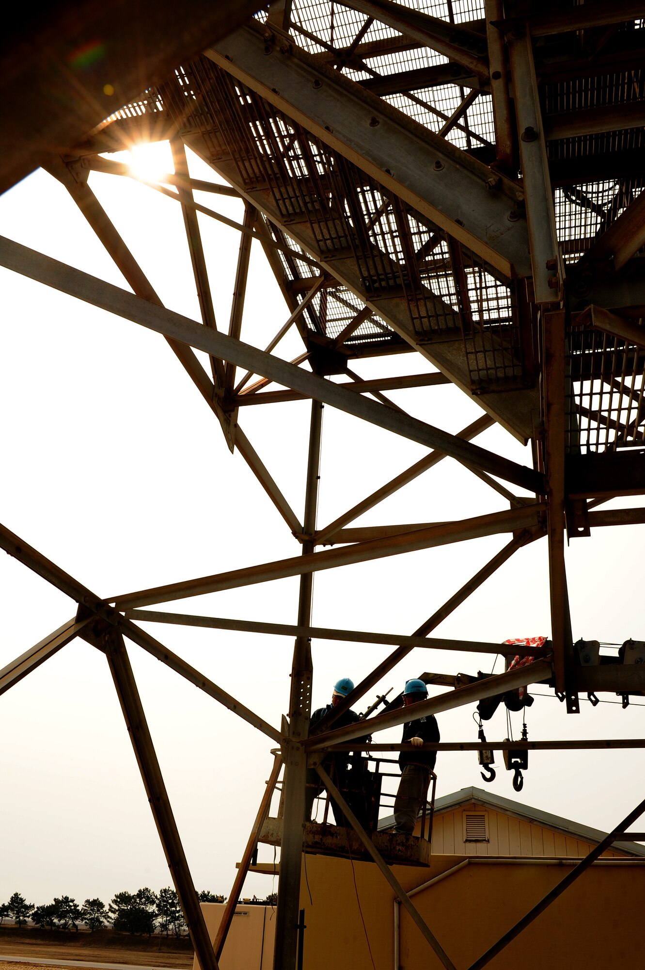 KUNSAN AIR BASE, Republic of Korea -- Kim Chang Wan and Seo Jung Jae, South Korean contractors, remove support beams from an outdated analog air traffic control radar’s support frame at Kunsan Air Base, Republic of Korea, March 28, 2013. The old radar system had become obsolete and was updated with modern digital radar technology.  (U.S. Air Force photo by Staff Sgt. Jonathan Fowler/Released) 