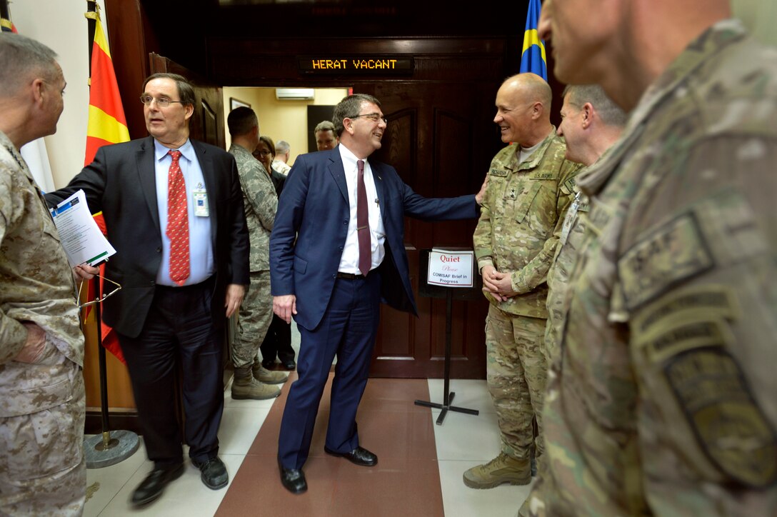 U.S. Deputy Defense Secretary Ash Carter, center, and David S. Sedney, deputy assistant secretary of defense for Afghanistan, Pakistan and Central Asia, left, thank a group of senior officers as they exit a meeting with U.S. Marine Corps Gen. Joseph F. Dunford Jr. and other allied officials at International Security Assistance Force headquarters in Kabul, Afghanistan, May 12, 2013. Dunford is commander of the international force and U.S. forces in Afghanistan.