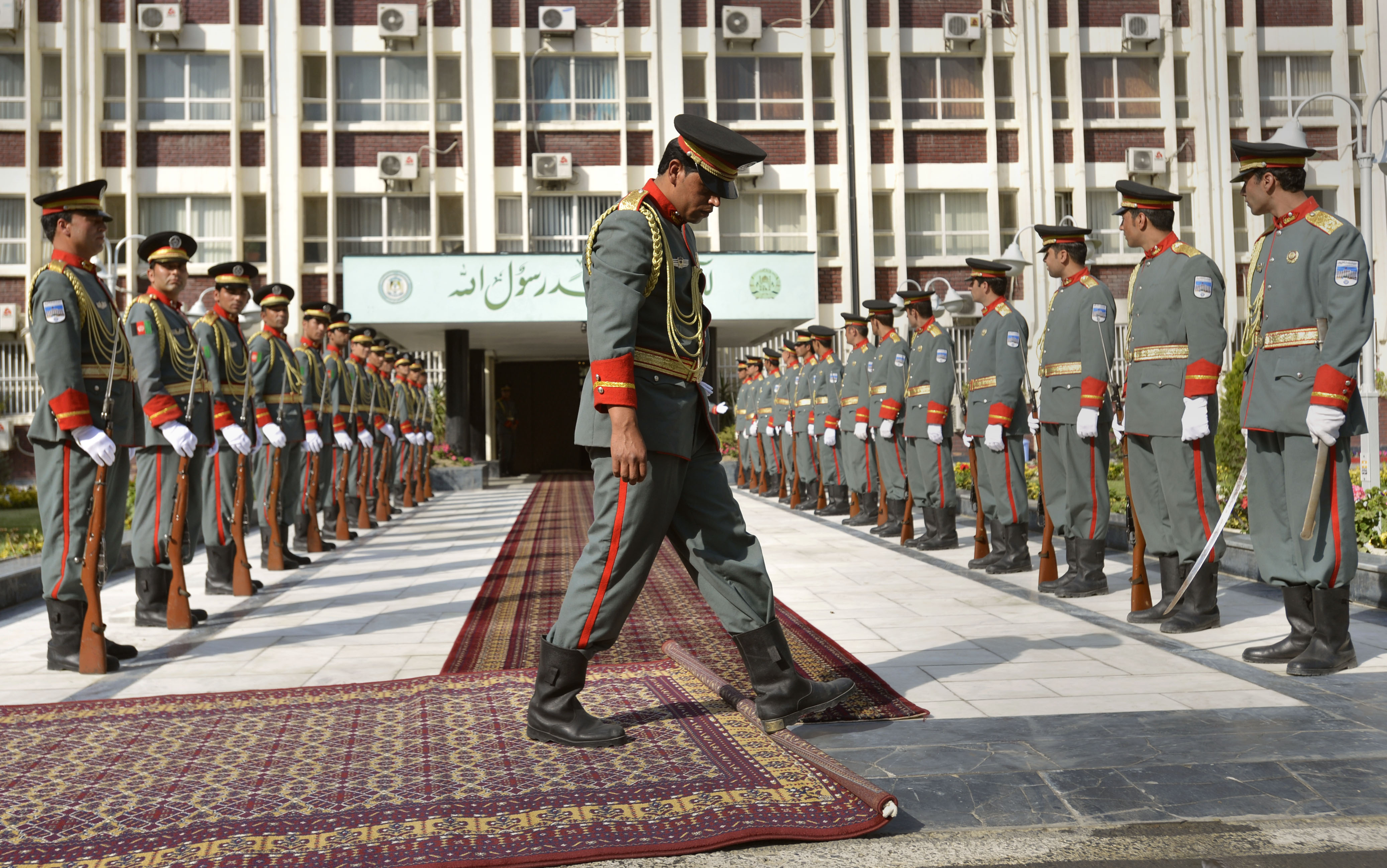 A Member Of The Afghanistan Army S Honor Cordon Rolls Out Red Carpet As They Prepare For