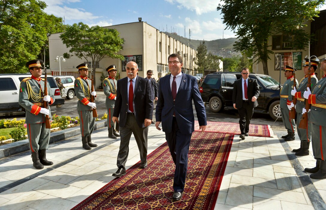 U.S. Deputy Defense Secretary Ash Carter receives an escort through an honor cordon as he arrives to meet with Afghan Interior Minister Ghulam Mujtaba Patang in Kabul, Afghanistan, May 12, 2013.