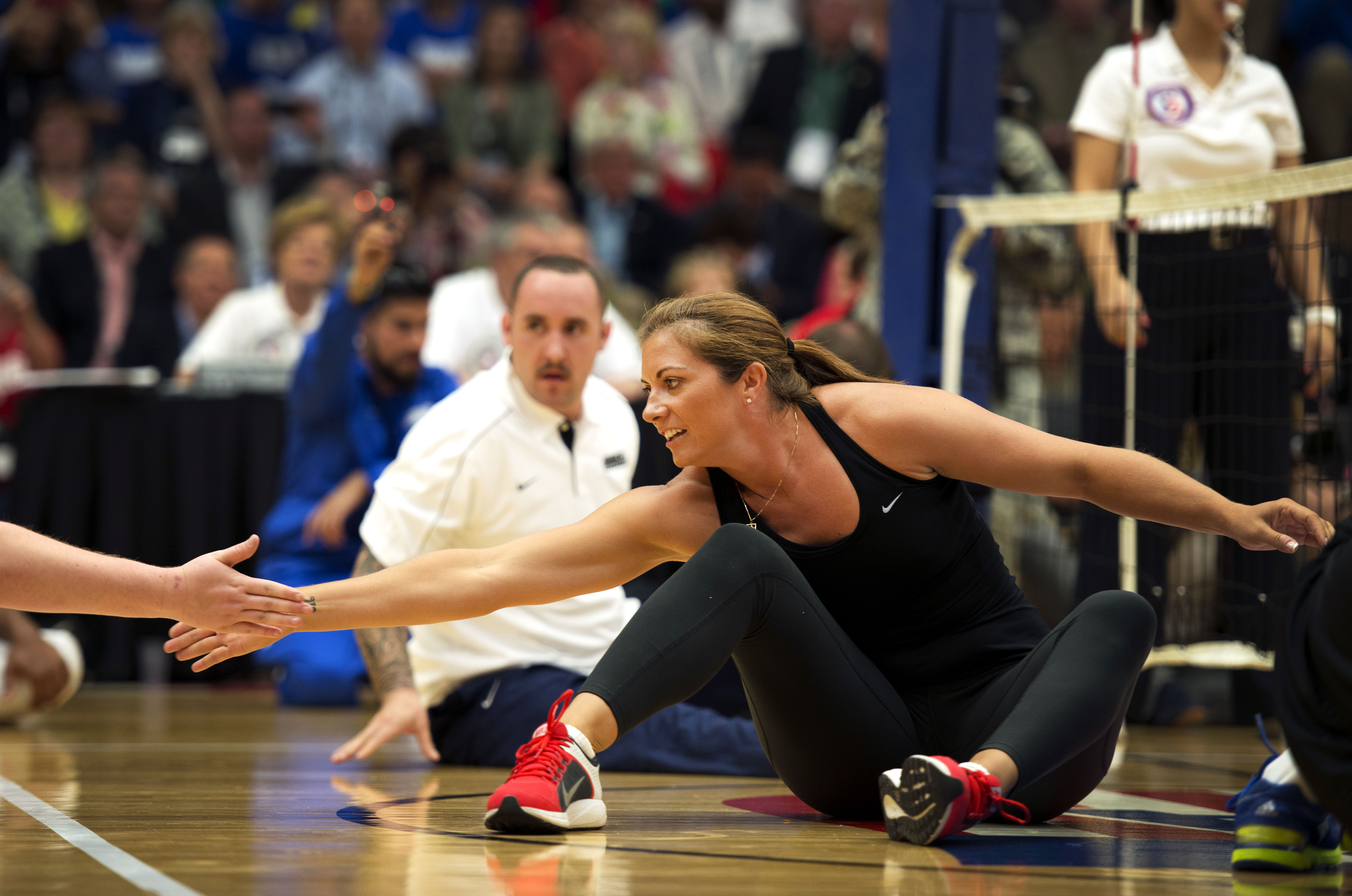 Misty May-Treanor, a three-time Olympic beach volleyball gold medalist,  plays with wounded warrior athletes