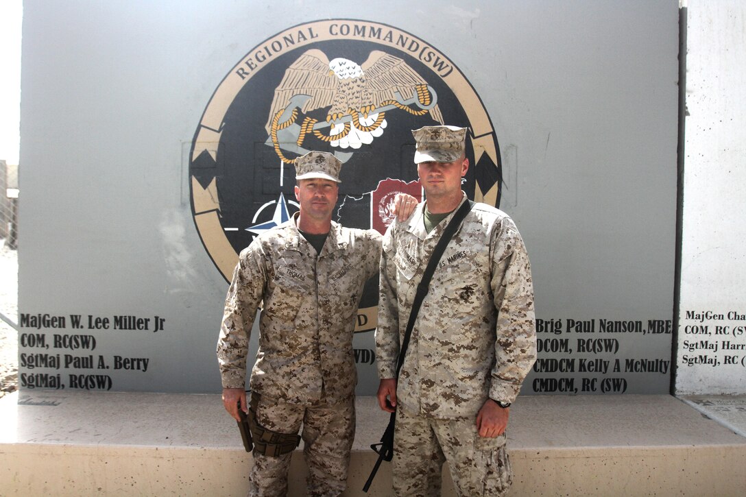 Chief Warrant Officer 5 Brice Thomas, left, and his son, Lance Cpl. Brice Thomas, II, pose for a photo at Camp Leatherneck, Afghanistan, April 27. Thomas is a strategic mobility officer with Regional Command (Southwest) and recently arrived in Afghanistan for a four-month deployment. Brice is an air logistics element noncommissioned officer in charge with II Marine Expeditionary Force (Forward) currently stationed at Camp Dwyer. The two reunited when the elder deployed to Afghanistan after his predecessor went home on emergency leave and the command decided a replacement was needed.