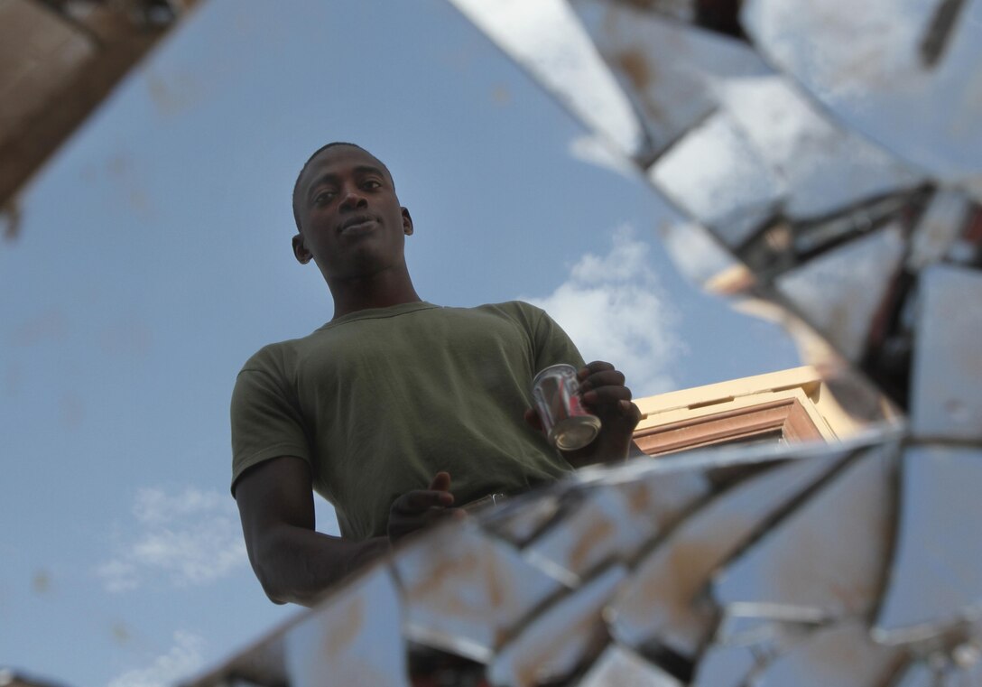 Lance Cpl. Mamadou Balde, a maintenance mechanic with General Support 2 Platoon, Retrograde Operations Company, Redeployment and Retrograde in Support of Reset and Reconstitution Operations Group, at Camp Dwyer, Helmand Province, Afghanistan, recently became a United States citizen during a recent ceremony at Kandahar Air Field.