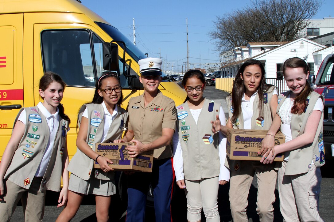 Sgt. Kristin Moreno, Recruiting Station New York’s marketing and public affairs representative, helps the Girl Scouts of Nassau County unload dozens of boxes of Girl Scout cookies during a cookie drop-off, May 2 at the 1st Marine Corps District headquarters building.  The drop-off was part of Operation Cookie, a Girl Scouts of America program intended to provide service members home and abroad with Girl Scout cookies.