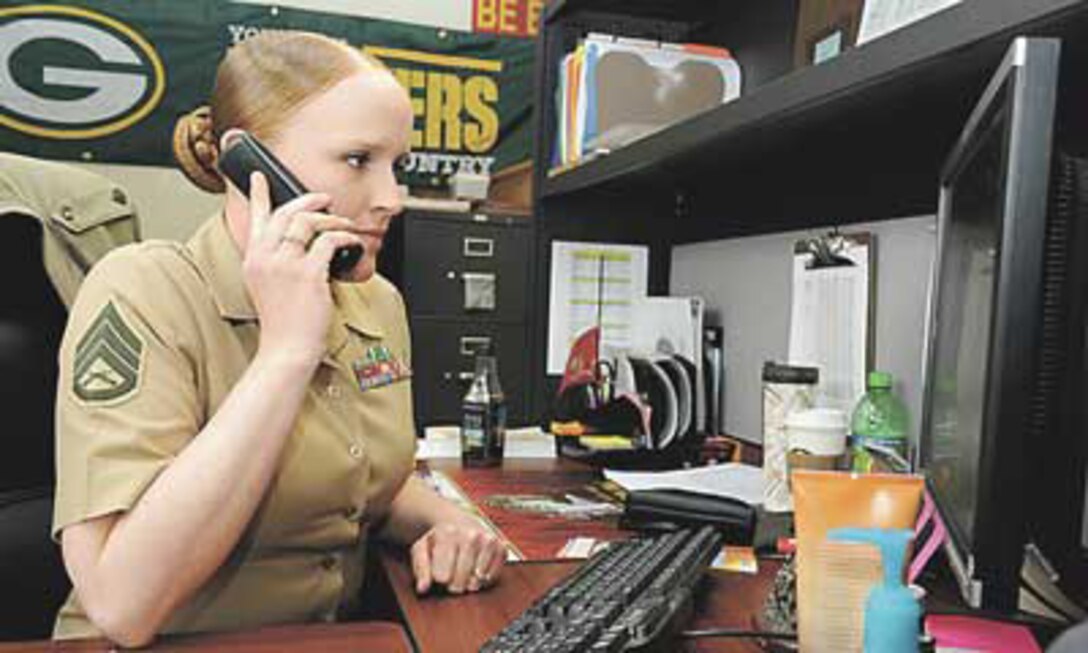 Marine Staff Sgt. Erin Rios, Motor Transport Instruction Company, Marine Corps Detachment, checks the schedule of classes on her computer. Rios was recently named TRADOC's Instructor of the Year. 