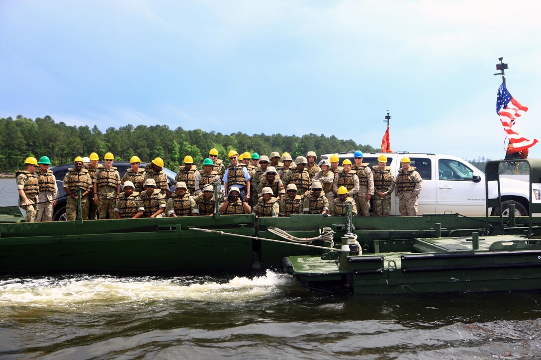 The Hon. George D. R. Fergusson (center), Governor of Bermuda, poses with soldiers with the Bermuda Regiment and Marines with 8th Engineer Support Battalion, 2nd Marine Logistics Group during Exercise Island Warrior aboard Camp Lejeune, N.C., May 7, 2013. Soldiers with the Bermuda Regiment received hands-on training from the Marines with 8th ESB on how to operate the MK III Bridge Erection Boats and to use them to construct and maneuver Improved Ribbon Bridges. 