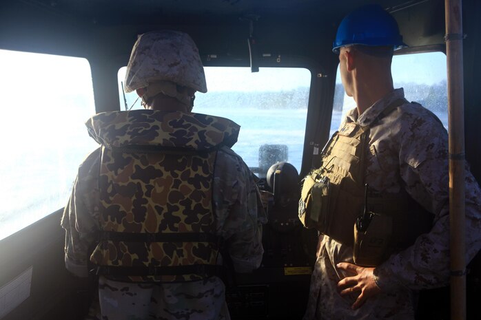 Lance Cpl. Joshua C. V. Iris (left), a gun assault pioneer with the Bermuda Regiment operates a MK III Bridge Erection Boat during Island Warrior training aboard Camp Lejeune, N.C., May 8, 2013. Marines with 8th Engineer Support Battalion, 2nd Marine Logistics Group instructed the Bermuda Regiment soldiers on how to use the MK III BEBs to move Improved Ribbon Bridges by using longitudinal and conventional rafting.