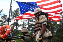 Soldiers with the Bermuda Regiment listen to instructions on how to use the MK III Bridge Erection Boats from Marines with 8th Engineer Support Battalion, 2nd Marine Logistics Group during Exercise Island Warrior aboard Camp Lejeune, N.C., May 7, 2013. Bermuda Regiment gun assault pioneers, or engineers, mostly use their abilities for humanitarian tasks, but came abroad to expand their knowledge as engineers and learned how to build and move Improved Ribbon Bridges in the water. 