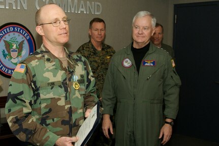 Lt. Col. David M. Funk (left) is awarded the Joint Service Commendation Medal in a Jan. 17, 2007, ceremony at the headquarters of North American Aerospace Defense Command and U.S. Northern Command at Peterson Air Force Base, Colo. Funk was recognized for providing emergency first aid at the scene of a Jan. 8, 2007, three-car accident until professional help arrived. Funk is chief of the Training and Exercise Branch of NORAD and USNORTHCOM. Presenting the award was NORAD and USNORTHCOM commander, Adm. Timothy J. Keating (right). 
