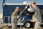 Chief Warrant Officer Ken Drennon and Master Sergeant Michael Winkler, of the South Carolina National Guard, Set up a Web Cam as part of Defense Interoperability Communication Exercise 2007 (DICE07).  DICE07 is a joint exercise, incorporating both DoD and non-DoD agency communications systems, with a goal of creating interoperability procedures that ensure robust support for global war on terror efforts and responses to natural disasters such as Hurricane Katrina. Photo by Mass Communication Specialist Steven J. Weber, Joint Task Force Civil Support public affairs.
