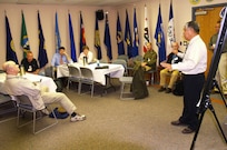 Joint Task Force North Deputy Director for Intelligence, Gabe Reyes, on right, leads a working group discussion on Intelligence Oversight.   The group focused on current IO issues and future applications of policy pertaining to the evolving nature of technology and interagency cooperation.