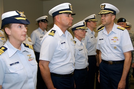 Rear Adm. John C. Acton, deputy commander for U.S. Coast Guard Mobilization and Reserve Affairs - Atlantic Area, inspects the reserve and active-duty Coast Guard troops assigned to U.S. Northern Command April 23 during a commissioning ceremony at Peterson Air Force Base for the new USNORTHCOM Coast Guard Reserve Unit. Capt. Douglas A. Ash commands the new reserve unit, which currently has five members and is expected to grow to 20 over the next few years. U.S. Northern Command and the U.S. Coast Guard effectively coordinate operations in multiple national defense mission areas, including maritime intercept operations, deployed port operations, maritime security and defense, peacetime engagement, and environmental defense operations.