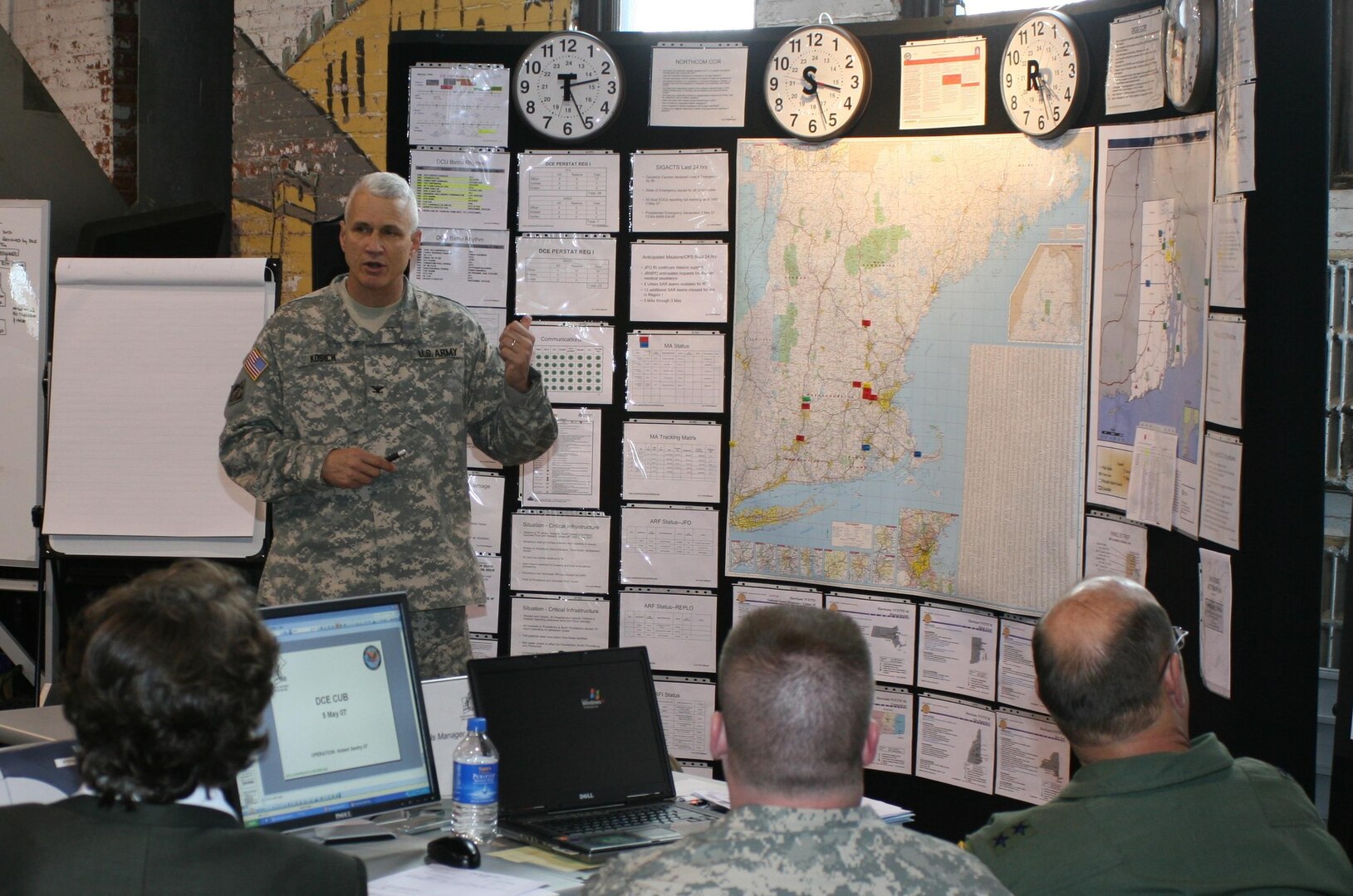 Col. Frank Kosich updates his staff on the status of Exercise Ardent Sentry '07 hurricane recovery operations. Kosich is the Federal Emergency Management Agency Region I Defense Coordinating Officer, whose job is to work with federal, state and local agencies to ensure U.S. Northern Command's Defense Support of Civil Authorities mission is carried out effectively. U.S. Army North provides the DCO to an area affected by a disaster should Department of Defense response be requested by the President or the Secretary of Defense.