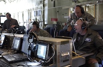 General Gene Renuart, far right, commander of North American Aerospace Defense Command and U.S. Northern Command, observes a demonstration April 17 of an airborne communications package aboard a C-130 aircraft at Peterson Air Force Base, Colo. The demonstration was conducted by the Joint Communications Support Element, a military unit composed of Army, Navy, Air Force and Marine Corps personnel, to show USNORTHCOM and civilian law enforcement organizations the communications capabilities the unit can provide to Department of Defense and other federal agencies. 
