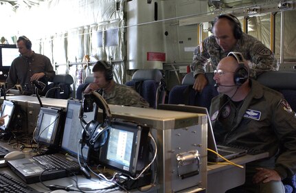 General Gene Renuart, far right, commander of North American Aerospace Defense Command and U.S. Northern Command, observes a demonstration April 17 of an airborne communications package aboard a C-130 aircraft at Peterson Air Force Base, Colo. The demonstration was conducted by the Joint Communications Support Element, a military unit composed of Army, Navy, Air Force and Marine Corps personnel, to show USNORTHCOM and civilian law enforcement organizations the communications capabilities the unit can provide to Department of Defense and other federal agencies. 