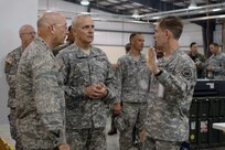 Maj. Gen. Bruce Davis (right), Joint Task Force Civil Support commander, briefs Gen. Gene Renuart (left), North American Aerospace Defense Command and U.S. Northern Command commander, and Lt. Gen. Tom Turner, U.S. Army Nort.h commander, May 12 in the JTF-CS Joint Operations Center at Camp Atterbury, Ind. JTF-CS is deployed to Indiana for Ardent Sentry 2007, an exercise that provides the command the opportunity to work with the National Guard, USNORTHCOM, federal agencies, and representatives from state, local and non-governmental organizations involved in homeland security. 