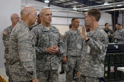 Maj. Gen. Bruce Davis (right), Joint Task Force Civil Support commander, briefs Gen. Gene Renuart (left), North American Aerospace Defense Command and U.S. Northern Command commander, and Lt. Gen. Tom Turner, U.S. Army Nort.h commander, May 12 in the JTF-CS Joint Operations Center at Camp Atterbury, Ind. JTF-CS is deployed to Indiana for Ardent Sentry 2007, an exercise that provides the command the opportunity to work with the National Guard, USNORTHCOM, federal agencies, and representatives from state, local and non-governmental organizations involved in homeland security. 