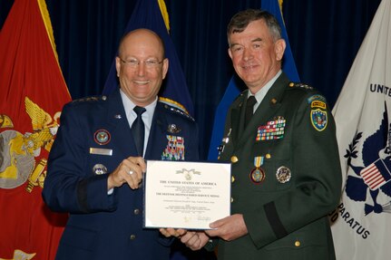 Gen. Gene Renuart, left, commander of North American Aerospace Command and U.S. Northern Command, congratulates Lt. Gen. Joseph R. Inge on his retirement from the U.S. Army after 38 years of service. Inge's last duty position was deputy commander of USNORTHCOM. 