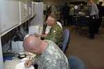 Soldiers from the United States and Canada test new technologies during the Coalition Warrior Interoperability Demonstration June 18. CWID provides the military, state and local as well as international partners use CWID to help ensure the technologies needed during inter-agency operations such as disaster relief go smoothly are truly useful to the operators who would use them should they be needed. 