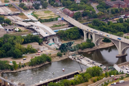 An aerial view of the devastation following the collapse of the I-35 bridge in Minneapolis, Minn. All active-duty military assets on the scene are under the command and control of a Defense Coordinating Officer and Defense Coordinating Element assigned to United States Army North, Fort Sam Houston, Texas. Army North provides Defense Support of Civil Authorities as the Army component of U.S. Northern Command, the unified command headquartered at Peterson Air Force Base, Colo., that is responsible for homeland defense and civil support. 