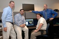 A team that developed a system that allows users at North American Aerospace Command and U.S. Northern Command to quickly and easily access detailed geospatial data has been selected to receive the 2007 United States Geospatial Foundation's achievement award in the military category. Members of the Space and Naval Warfare Center C4I Engineering Support Team are, left to right, Gary Koch, Chris Mayfield, Dave Gokey and Dave McKinley