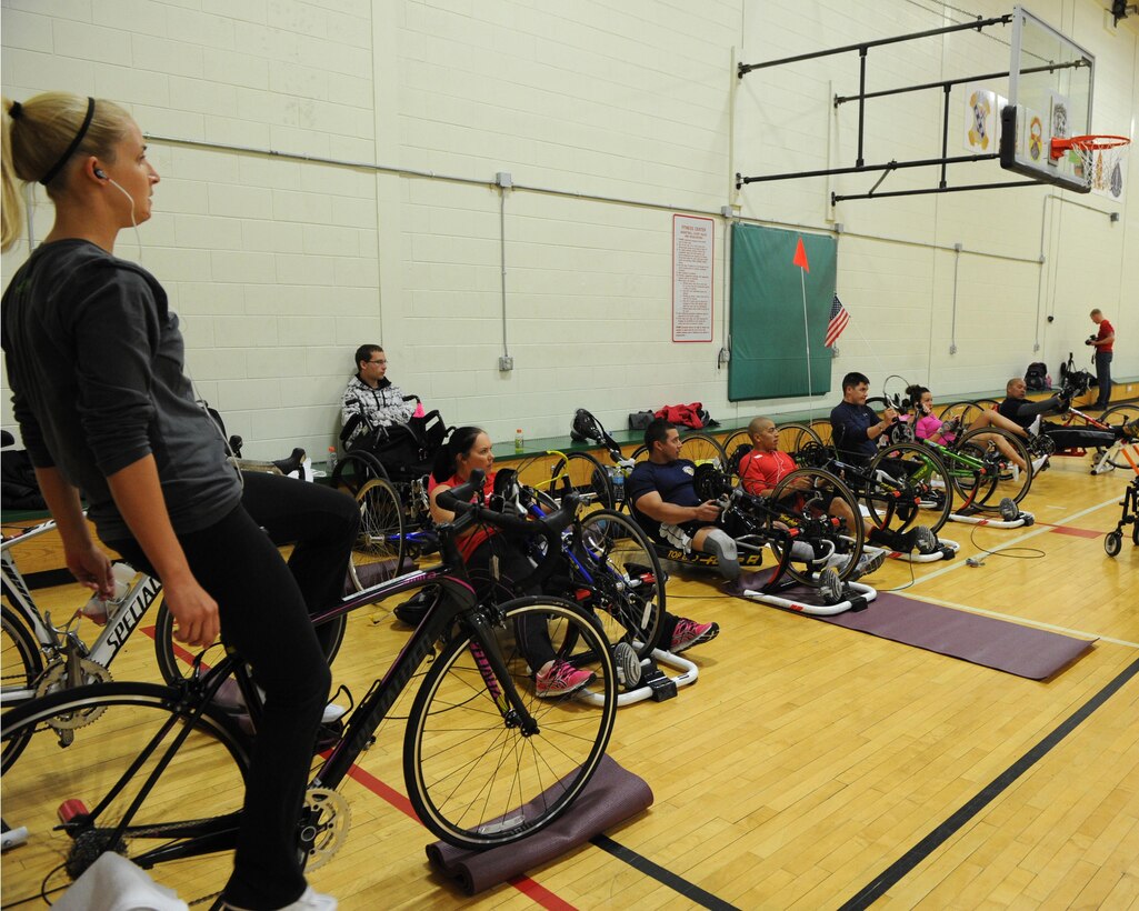 U.S. Marine Corps Sergeant Kirstie Ennis with Wounded Warrior West, from Milton, Fla., practice cycling during the 2013 All-Marine Warrior Games team training camp on Fort Carson, in Colorado Springs, Colo. The training camp is a two-week camp in order for the Marines to prepare for the 2013 Warrior Games. The Warrior Games is a Paralympic style competition to elevate wounded, ill and injured service member's abilities through athletic competition.  The forth annual Warrior Games will be held at the Olympic Training Center and Air Force Academy in Colorado Springs, Colo., May 10-16.  Athletes will have a chance to compete in swimming, track and field, volleyball, wheelchair basketball, cycling, shooting and archery.  The All-Marine team will defend their first place title against the Army, Navy /Coast Guard, Air Force and SOCOM. 