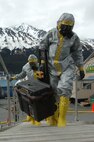 SEWARD, Alaska Ð Members of the National Guard's civil support team board the USNS Henry J. Kaiser in biohazard suits here May 11 to investigate a simulated report of suspicious chemicals aboard during an exercise scenario for Alaska Shield/Northern Edge 2007.  The civil support team worked in conjunction with the Seward police and fire departments, the Coast Guard, the FBI, and many other organizations to practice interagency coordination in an emergency situation.  AKS/NE 07 is a State of Alaska/US NORTHCOM sponsored homeland defense/defense support of civil authorities exercise; part of the national-level Ardent Sentry/Northern Edge 07.  U.S. Navy photo by Mass Communication Specialist 1st Class Daniel N. Woods