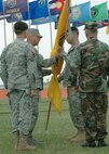 General Victor E. Renuart Jr., commander North American Aerospace Defense Command and U.S. Northern Command,  passes the Command Colors to Maj. Gen. Daniel E. Long Jr., commander Joint Task Force Civil Support, oficially passing command of the unit. Photo by Staff Sgt. Chris Hale