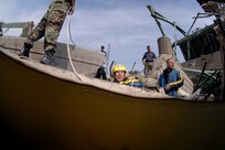 Members of  Mobile Diving and Salvage Unit Two (MDSU 2) from Naval Amphibious Base Little Creek, Virginia swim through debris searching for victums of the I 35 bridge collapse on 8 August, 2007. Navy divers from MDSU 2 stationed at Naval Amphibious Base Little Creek work in tandem with federal, state, and local government agencies in the search and recovery process.
