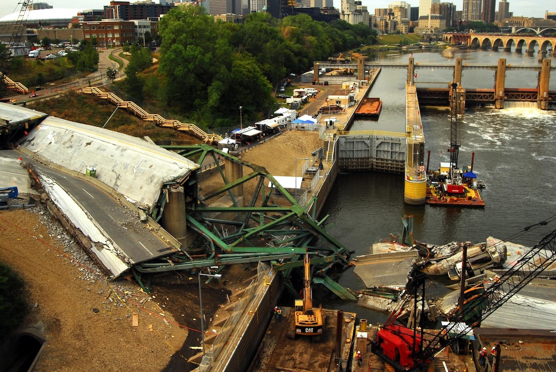 The I-35 bridge collapse site over the Mississippi river 13 days after the collapse. Mobile Diving and Salvage Unit 2 are assisting other federal, state, and local authorities in the recovery efforts at the site.  