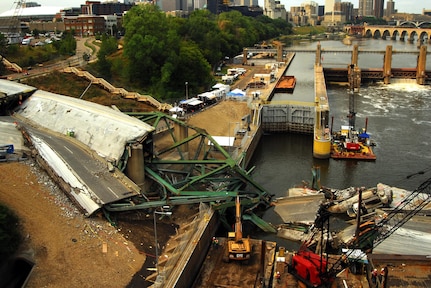 The I-35 bridge collapse site over the Mississippi river 13 days after the collapse. Mobile Diving and Salvage Unit 2 are assisting other federal, state, and local authorities in the recovery efforts at the site.  