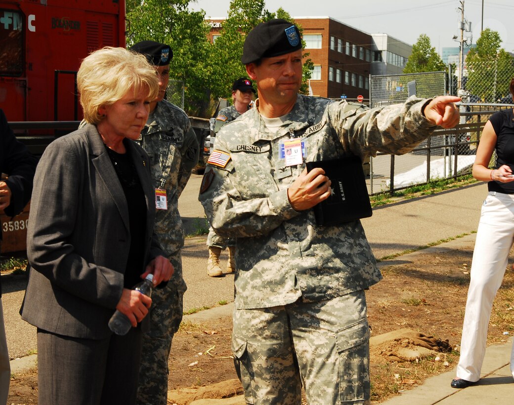 Secretary of Transportation, Mary E. Peters, tours the site of the I-35 bridge collapse over the Mississippi river, with Col. Michael Chesney, defense coordinating officer, Aug. 10. Secretary Peters was briefed on the current situation and the progress of the multi-agency search and recovery effort. U.S. Navy photo by Mass Communication Specialist Seaman Joshua Adam Nuzzo