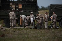 Marines with Ammunition Company, 2nd Supply Battalion, 2nd Marine Logistics Group organize pallets of ammunition during an explosive ordnance disposal, or EOD, training exercise aboard Camp Lejeune, N.C., May 7, 2013. The company’s Marines detonated the munitions to train for situations in which EOD Marines might be unavailable. 