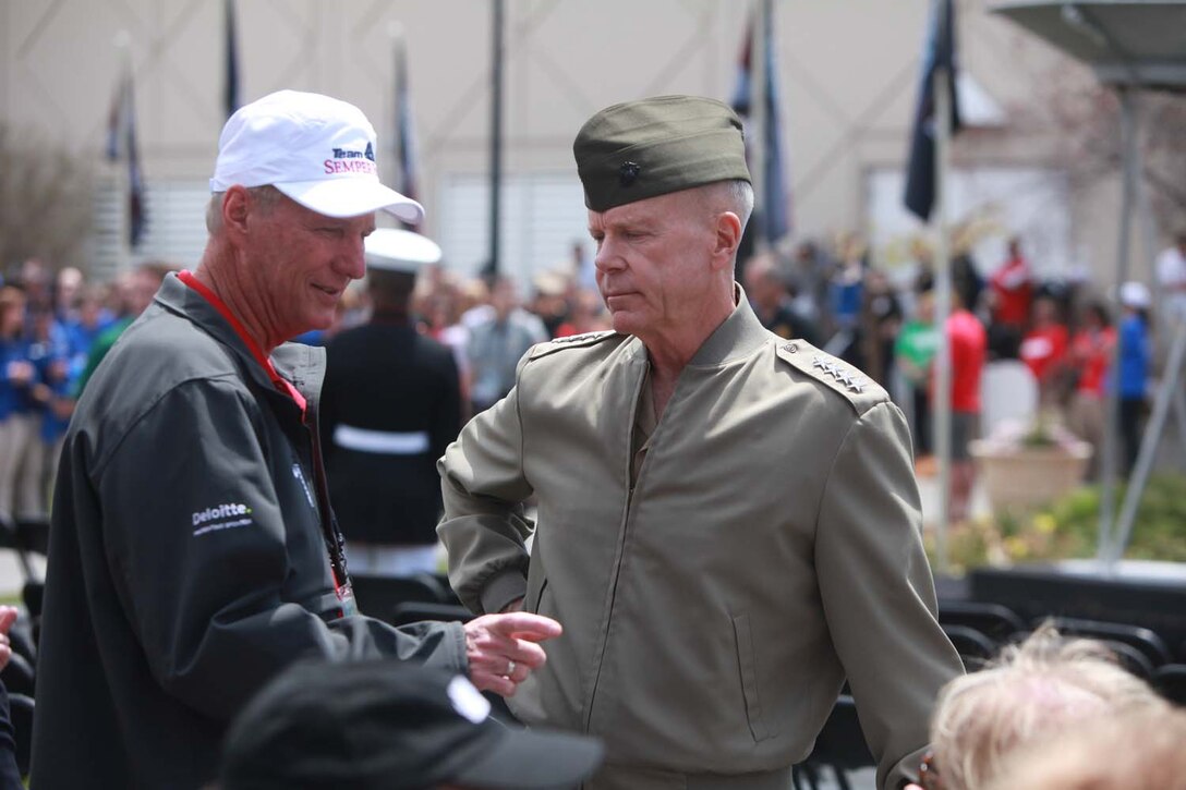 Commandant of the Marine Corps Gen. James F. Amos was in attendance at the opening ceremony of the 2013 Warrior Games. The Games aim to encourage wounded, ill and injured service members and veterans to focus on their abilities and to find new avenues to thrive. The fourth annual Warrior Games will be held at the Olympic Training Center and Air Force Academy in Colorado Springs, Colo., May 10-16.  Athletes will compete in swimming, track and field, volleyball, wheelchair basketball, cycling, shooting and archery.  The Marine Warrior Games team will defend their championship title against the Army, Navy /Coast Guard, Air Force and SOCOM. Photo by Lance Cpl. Scott Reel