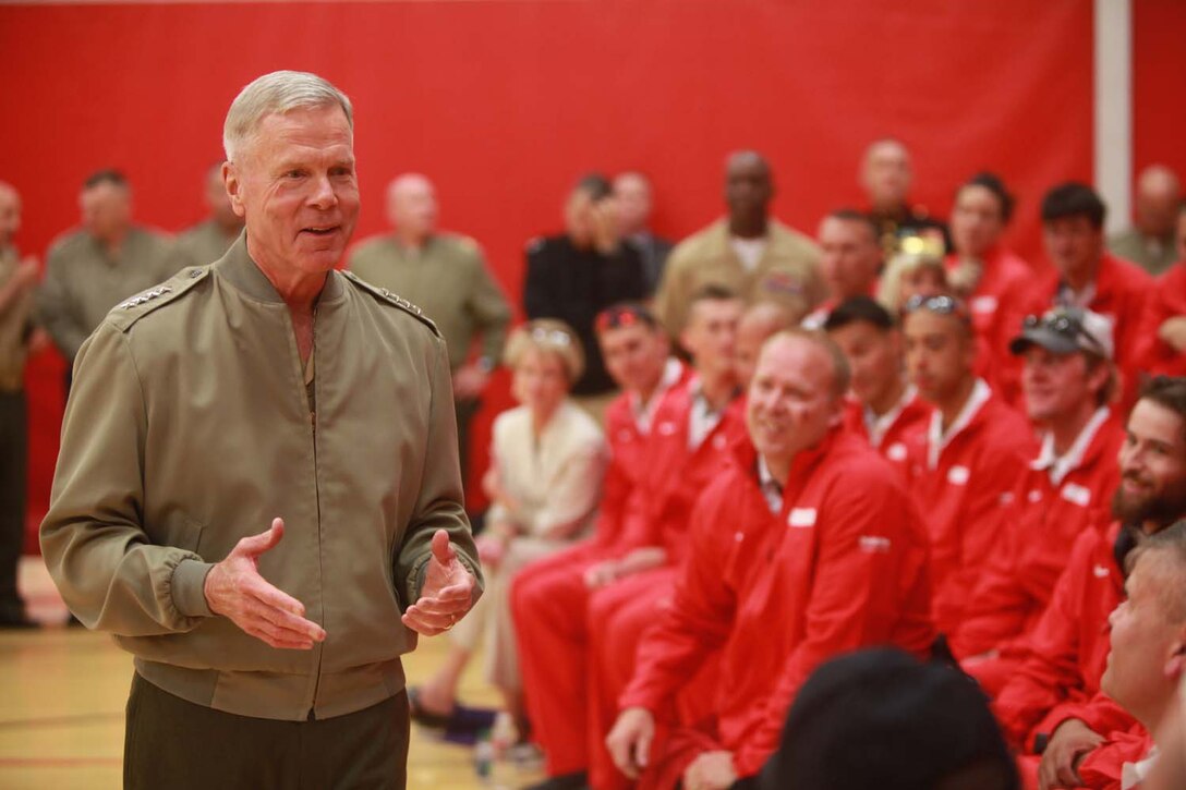 Commandant of the Marine Corps Gen. James F. Amos and Sergeant Major of the Marine Corps Micheal P. Barrett, visited the Marine competitors at the opening ceremony of the 2013 Warrior Games. Athletes will compete in swimming, track and field, volleyball, wheelchair basketball, cycling, shooting and archery.  The Marine Warrior Games team will defend their championship title against the Army, Navy /Coast Guard, Air Force and SOCOM. Photo by Lance Cpl. Scott Reel