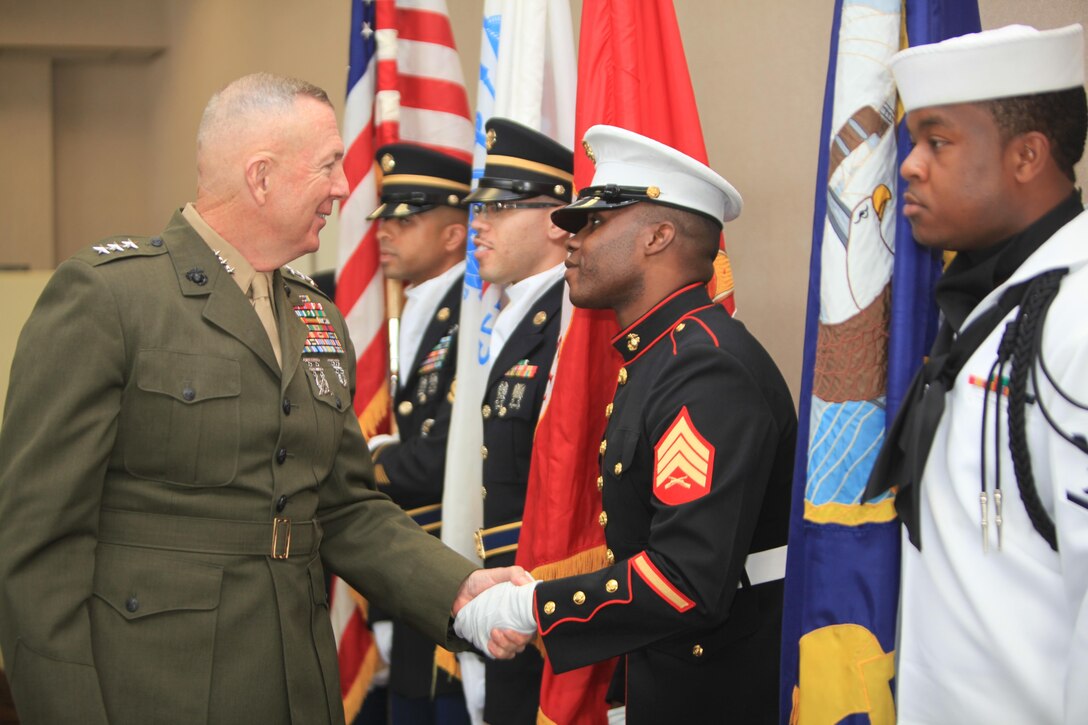 Lt. Gen. Steven A. Hummer, commander of Marine Forces Reserve and Marine Forces North, greets members of the joint-service color guard at the Federal Executive Board Distinguished Service Awards luncheon at the NASA Michoud Assembly Facility here, May 8. The luncheon was a part of New Orleans Public Service Recognition week, sponsored by the New Orleans mayor’s office. (U.S. Marine Corps photo by Lance Cpl. Tiffany Edwards/Released)