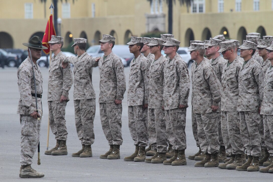 Marines of Company E, 2nd Recruit Training Battalion, get their alignment during graduation practice aboard Marine Corps Recruit Depot San Diego April 24.