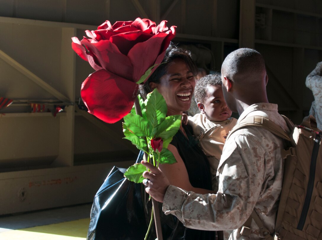 After serving at sea with the 15th Marine Expeditionary Unit aboard the USS Peleliu, Marine Attack Squadron 311 Staff Sergeant Douglas Bridges reunites with his wife and children in the VMA-311 Hangar aboard Marine Corps Air Station Yuma, May 13.  Bridges, an Atlanta, GA native and VMA-311 airframes mechanic, served alongside approximately 2,400 Marines and Sailors and deployed as part of the Peleliu Amphibious Ready Group. This group provides a forward-deployed, flexible sea-based Marine Air Ground Task Force capable of conducting a wide variety of operations ranging from humanitarian aid to combat.