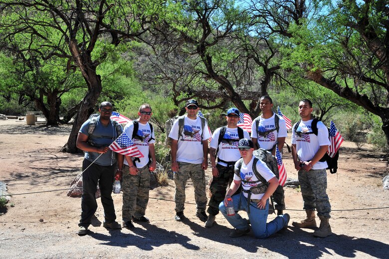 Airmen from the 355th Force Support Squadron pose for a photo at Colossal Caves Mountain Park, Vail,  Ariz., May 11, 2013. They are participating in the Rucking for Vets event.(U.S. Air Force photo by Airman 1st Class Josh Slavin/Released)