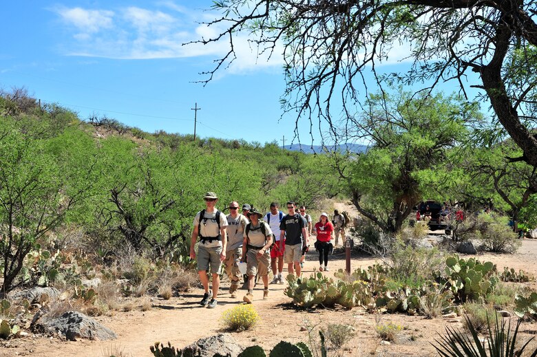 Participants begin the second part of the hike at Colossal Caves Mountain Park, Ariz., May 11, 2013. The individuals are carrying between 25 and 65 pounds of canned goods that were later donated to  the Tucson Community Food Bank.(U.S. Air Force photo by Airman 1st Class Josh Slavin/Released)