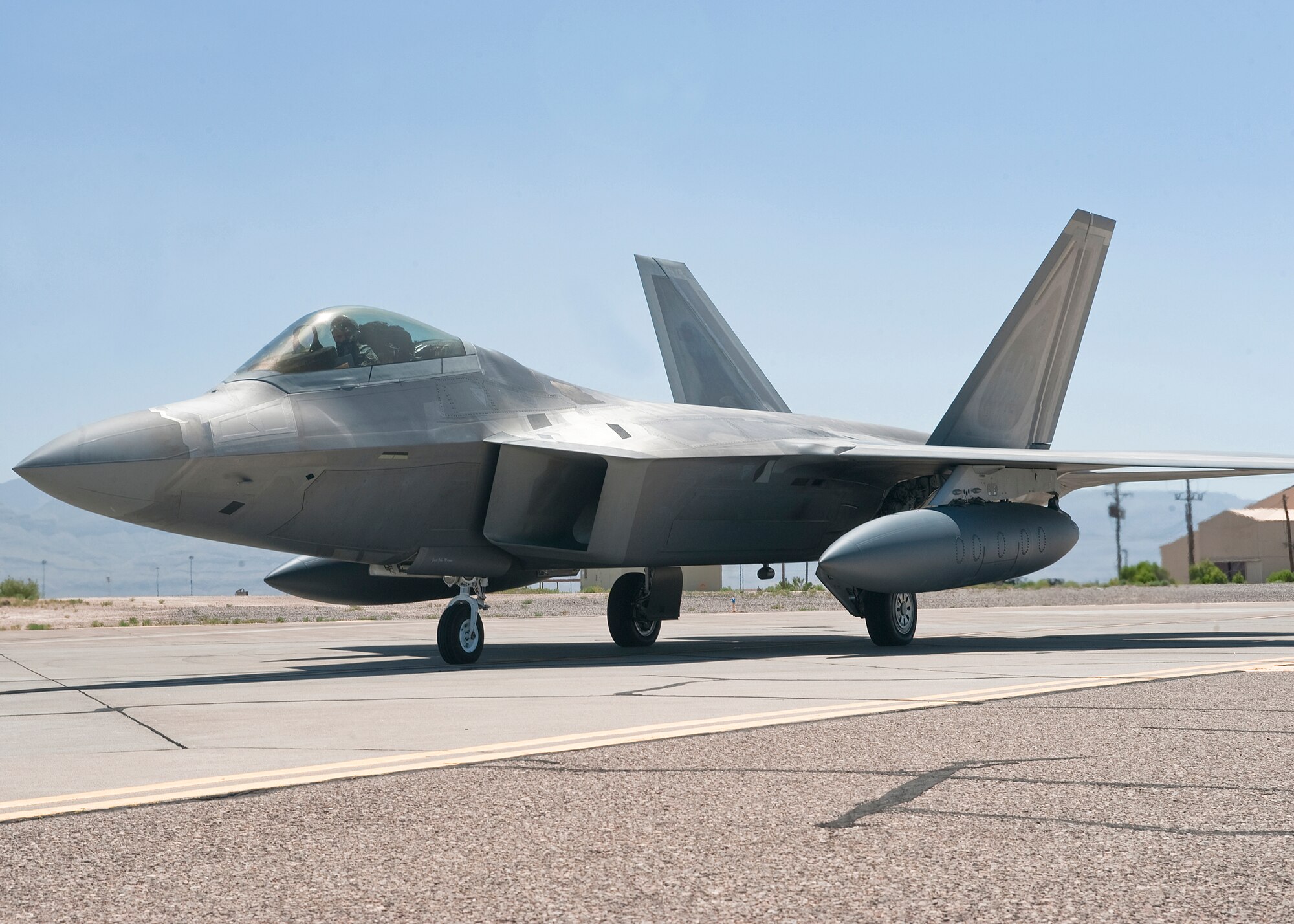 An F-22 Raptor from the 7th Fighter Squadron taxis on the runway at Holloman Air Force Base.  For training, it utilizes the massive area known as "Raptor Airspace," which fully overlays the Tularosa Basin and the Sacramento Mountains.  (U.S. Air Force photo by Senior Airman DeAndre Curtiss/Released)