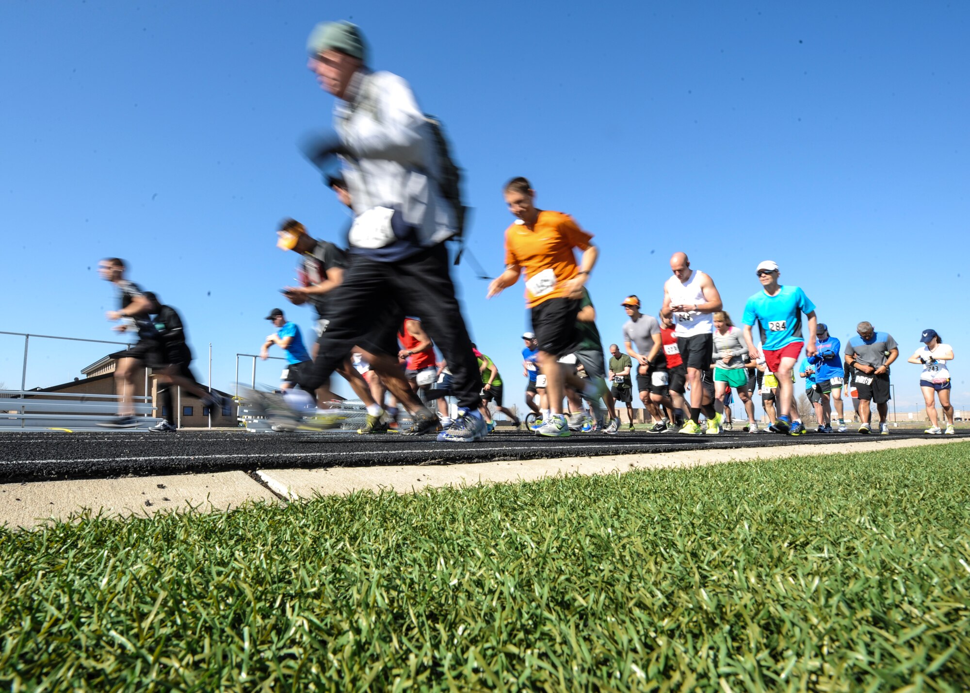 Buckley half marathon runners start their journey May 11, 2013, on the track at Buckley Air Force Base, Colo. About 50 runners participated in the 7th Annual Buckley Half Marathon. The Buckley Fitness Center organized several different endurance events leading up to the race. (U.S. Air Force photo by Staff Sgt. Christopher Gross/Released)