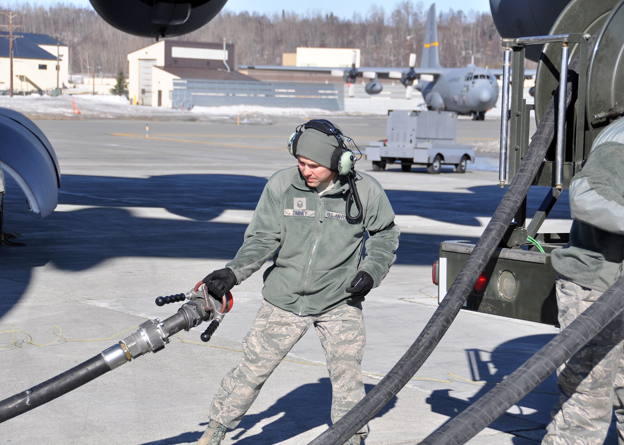 Master Sgt. David Timney, a 446th Aircraft Maintenance Squadron hydraulic technician out of McChord Field, Wash., drags a hose to fuel a C-17 Globemaster III at Joint Base Elmendorf-Richardson, Alaska, April 25. Timney and other 446th AMXS Reservists were at JBER fulfilling their two-week annual training requirements with the 732nd Air Mobility Squadron, JBER, April 21 to May 5. (U.S. Air Force photo/Tech. Sgt. Dana Rosso)